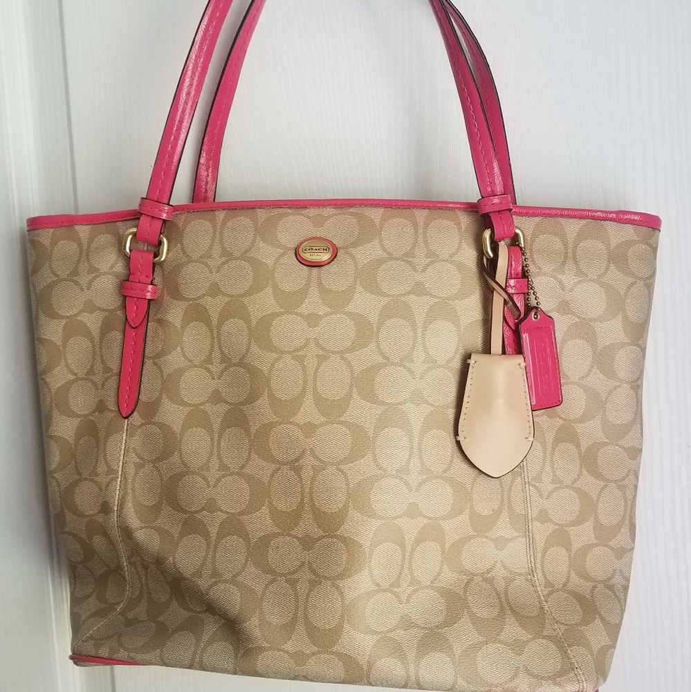 Tan coach bag with pink accents